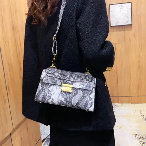 Chic Snakeskin Print Crossbody Bag with Gold Accents