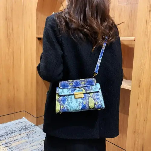 Chic Snakeskin Print Crossbody Bag with Gold Accents