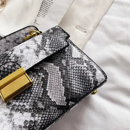 Chic Snakeskin Print Crossbody Bag with Gold Accents
