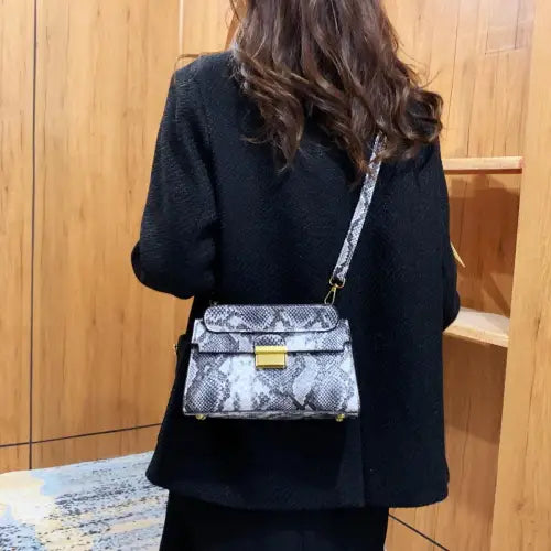 Chic Snakeskin Print Crossbody Bag with Gold Accents