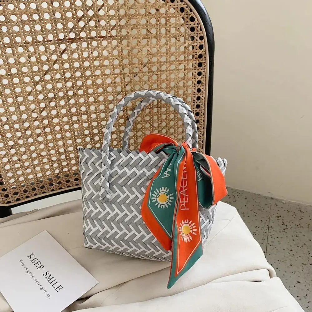 Vibrant Contrast Woven Handbag with Stylish Scarf Accent