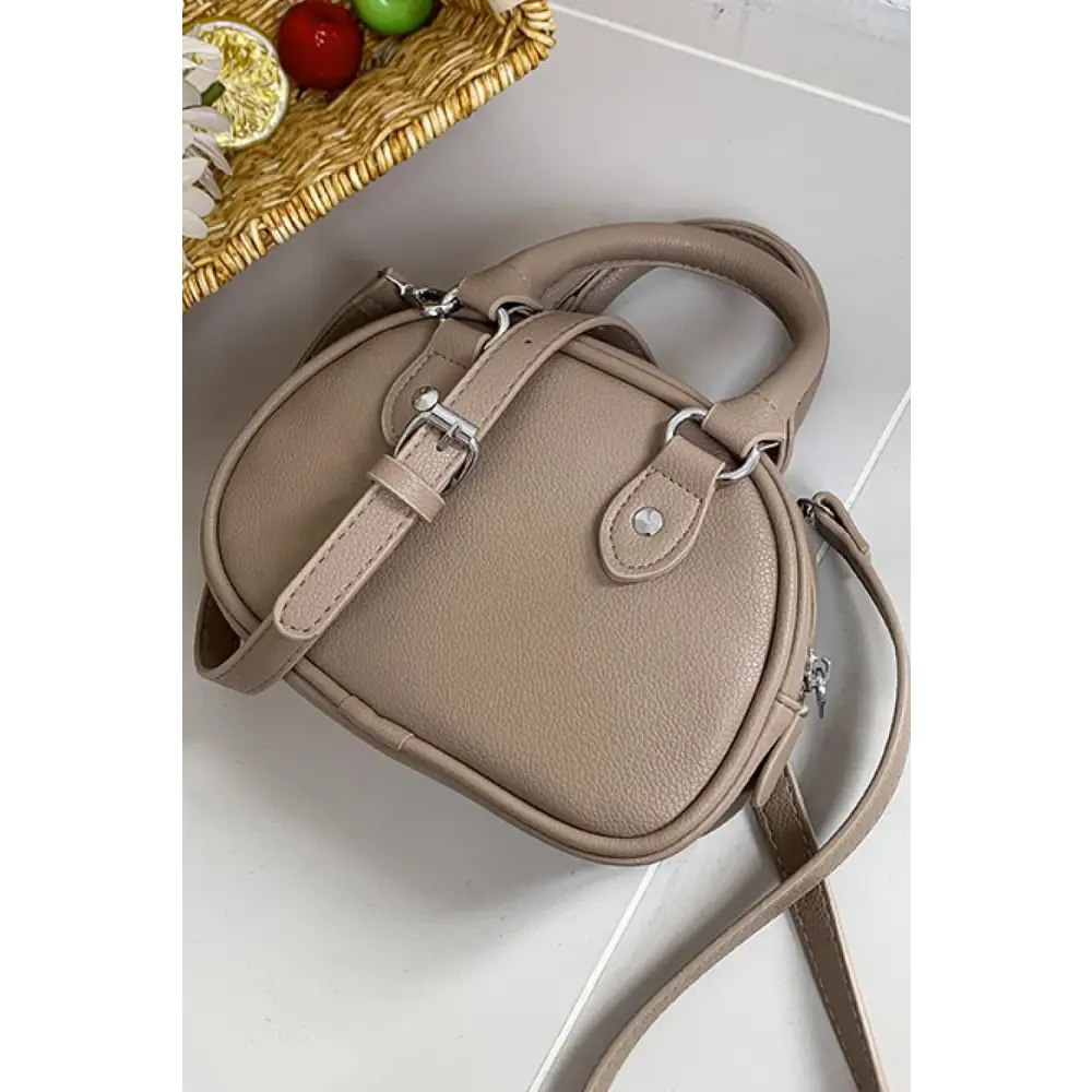 Stunning Gold Dome Leather Handbag Elevates Your Style