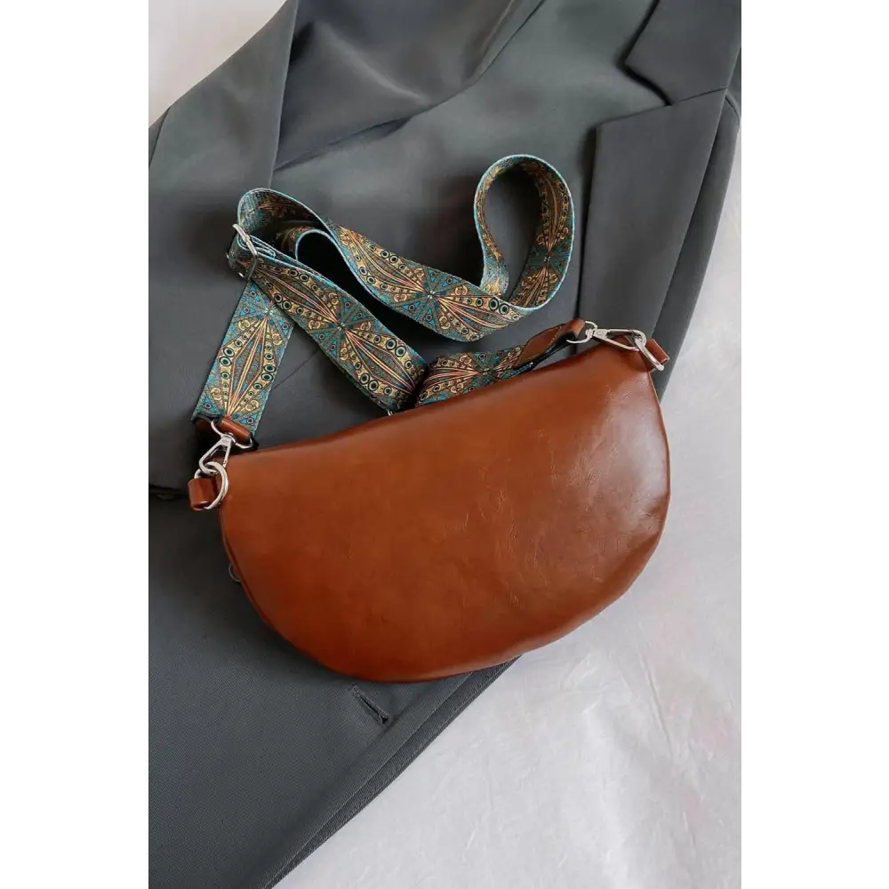 Stylish Leather Sling Bag with Unique Patterned Strap