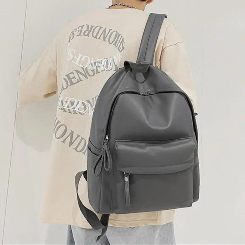 Sleek Black Leather Zip Backpack Bag with Original Tags