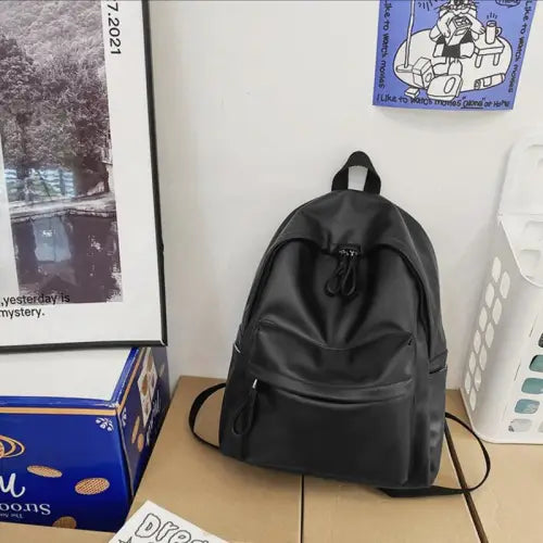Sleek Black Leather Zip Backpack Bag