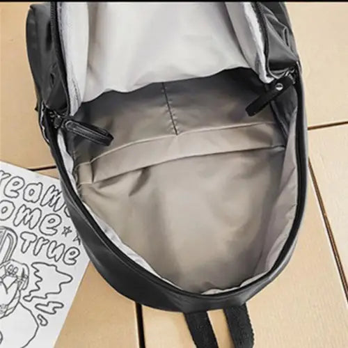 Sleek Black Leather Zip Backpack Bag