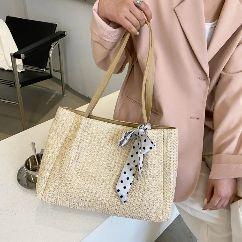 Chic Straw Woven Leather Strap Handbag with Polka Dot Charm